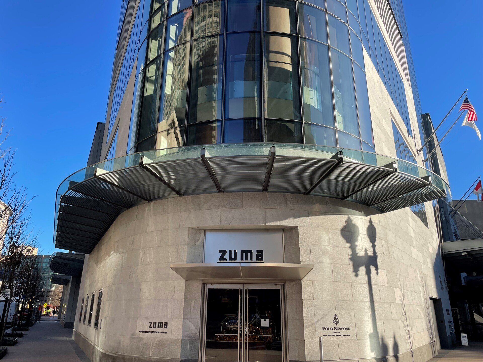 A large building with a sign that says zuma on it
