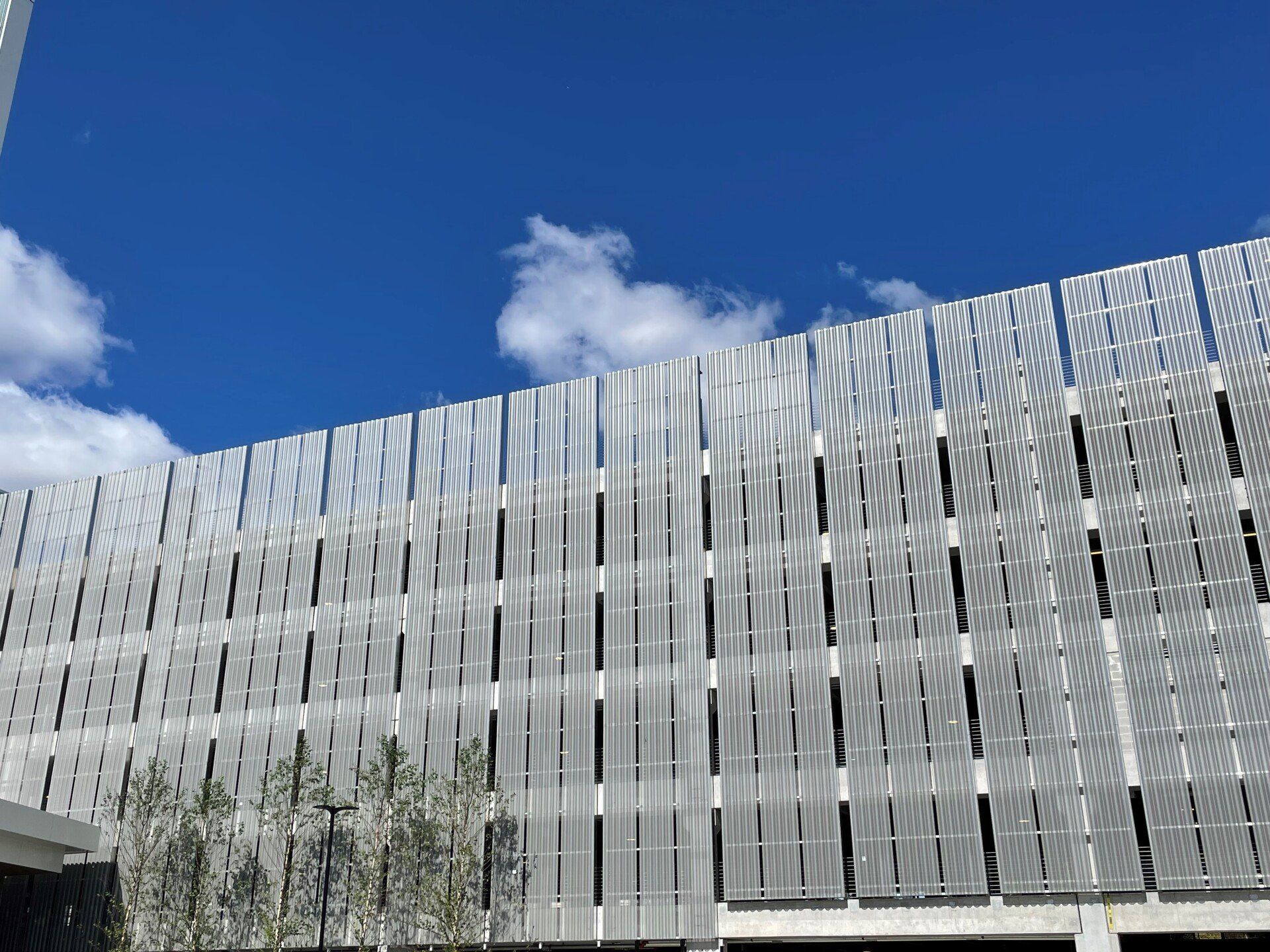 A large building with a blue sky in the background