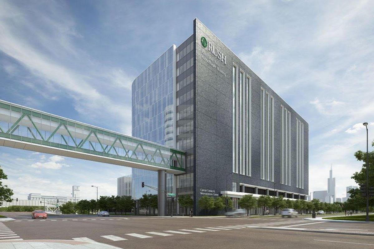 An artist 's impression of a large building with a bridge over it.