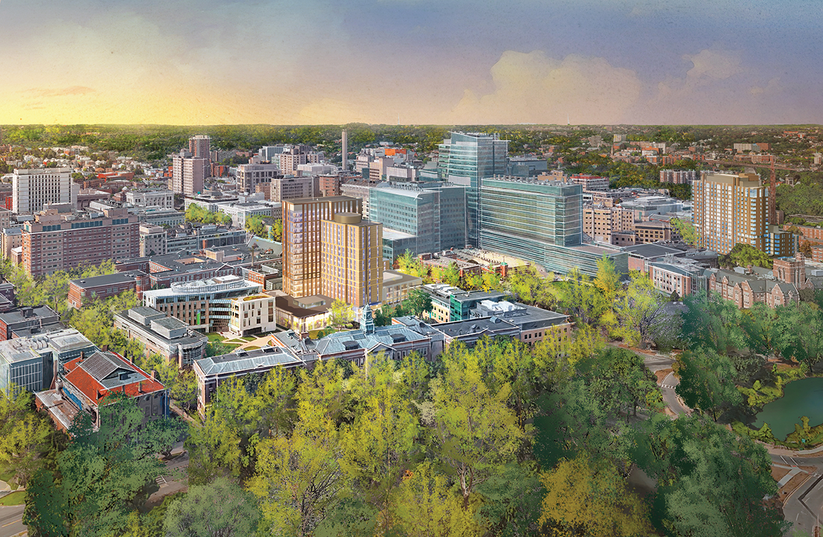 an aerial view of a city surrounded by trees and buildings .