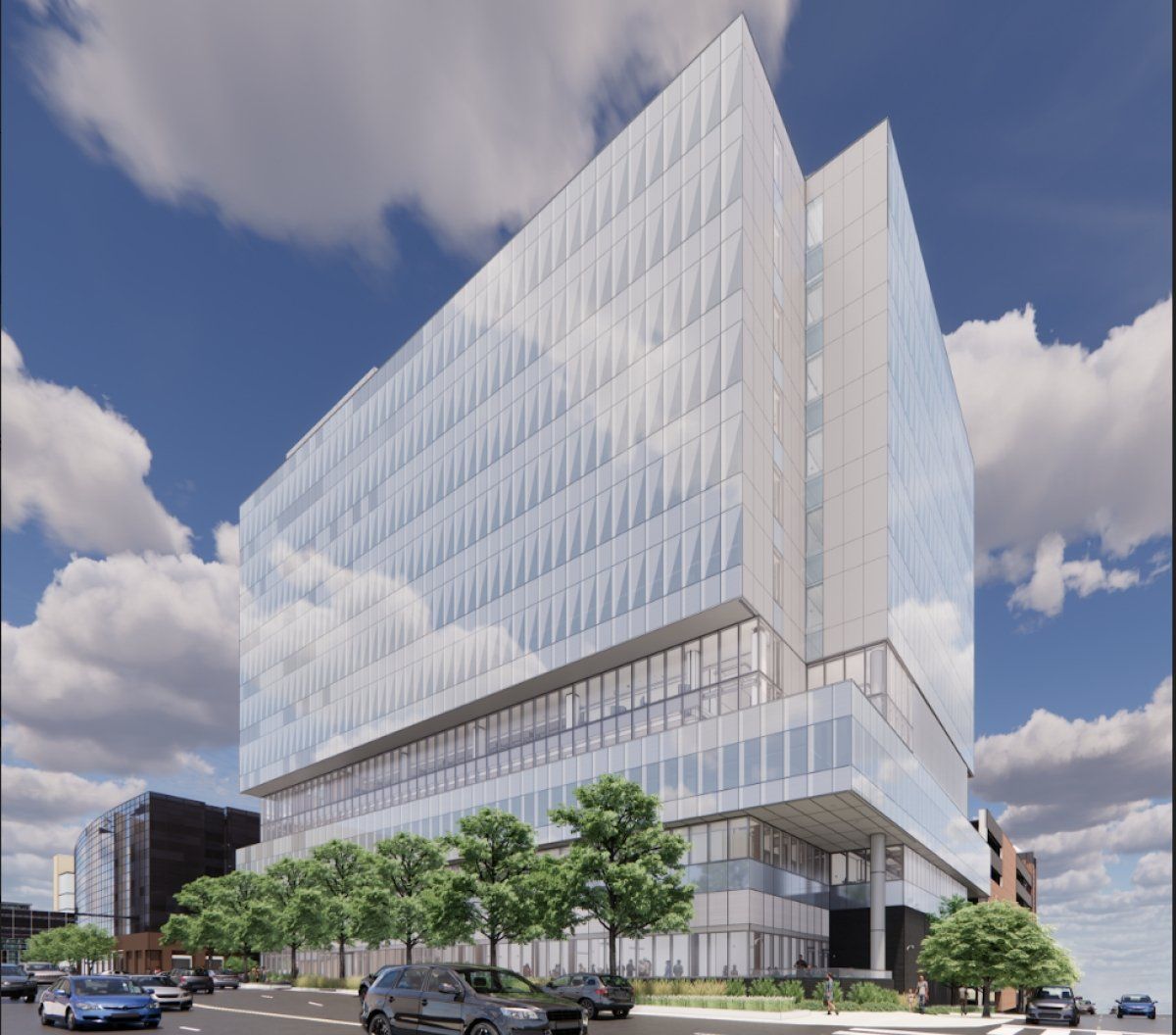 An artist 's impression of a large building with lots of windows