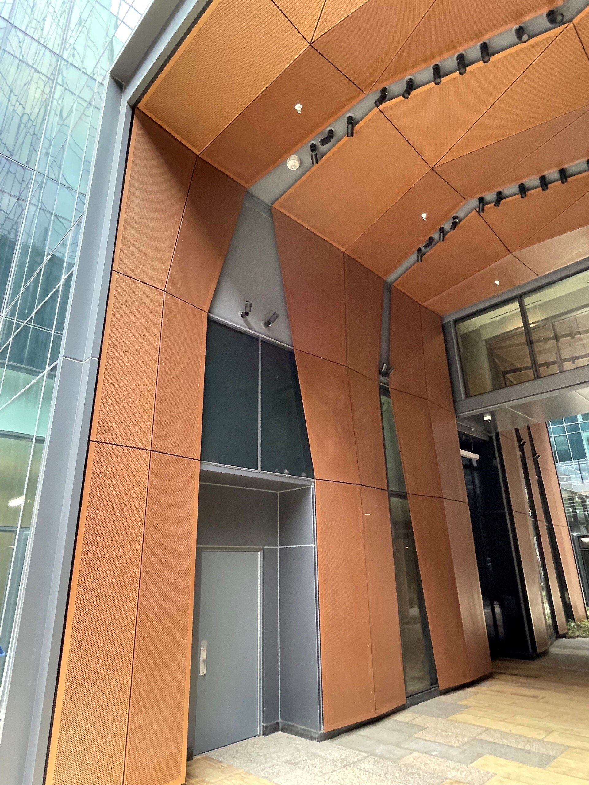 A large building with a wooden ceiling and a door.