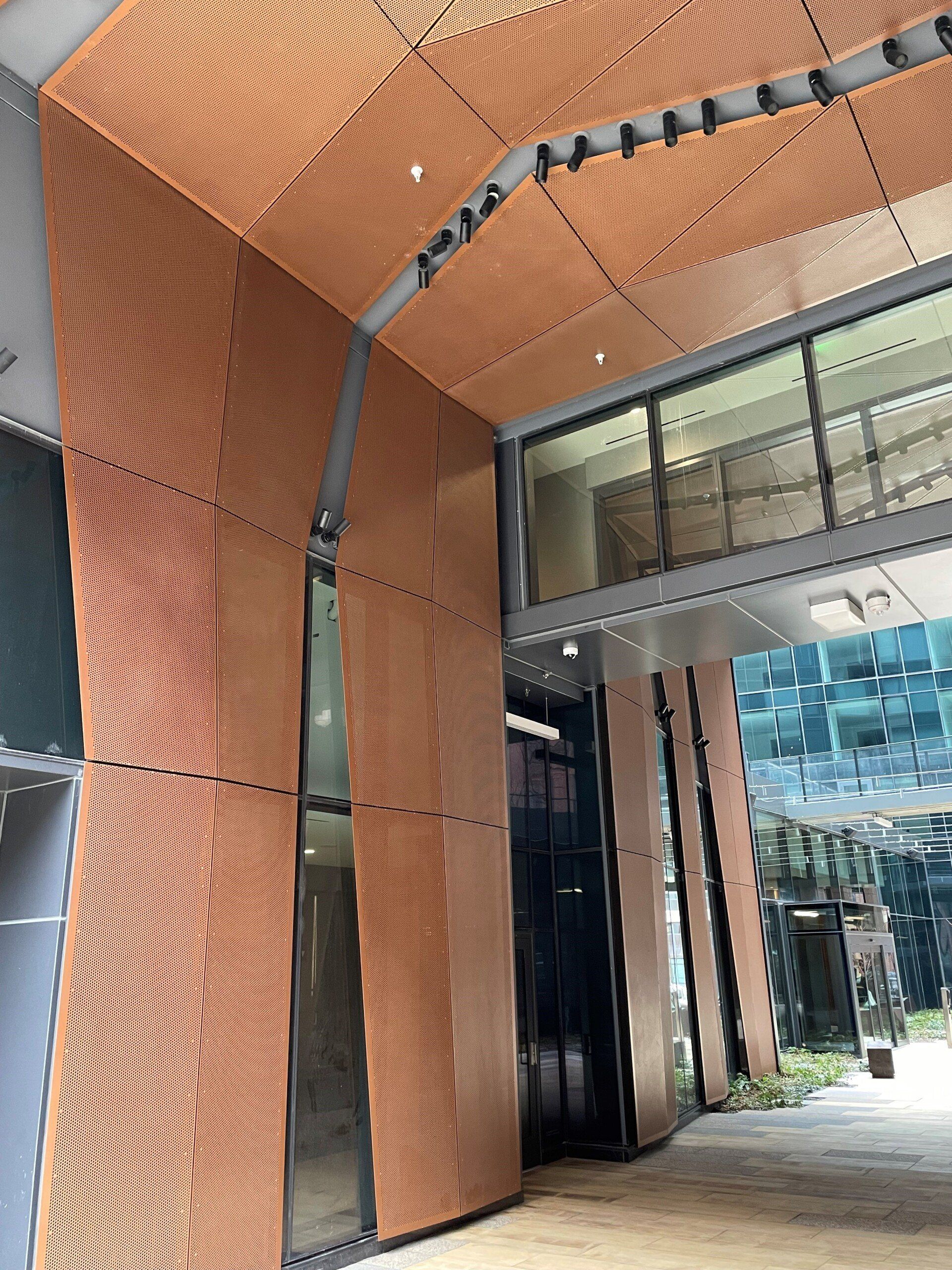 A building with a lot of windows and a wooden ceiling