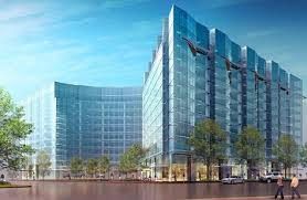 An artist 's impression of a large building with a lot of windows.