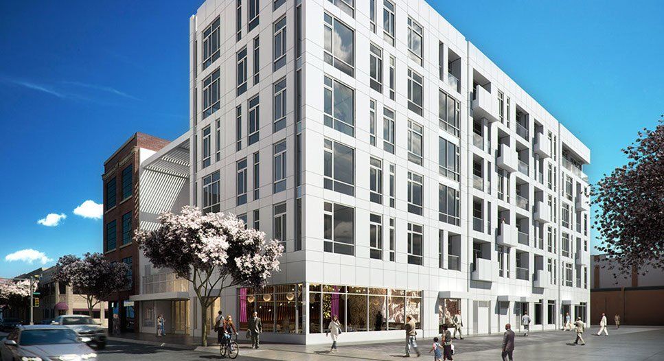 An artist 's impression of a large white building with lots of windows