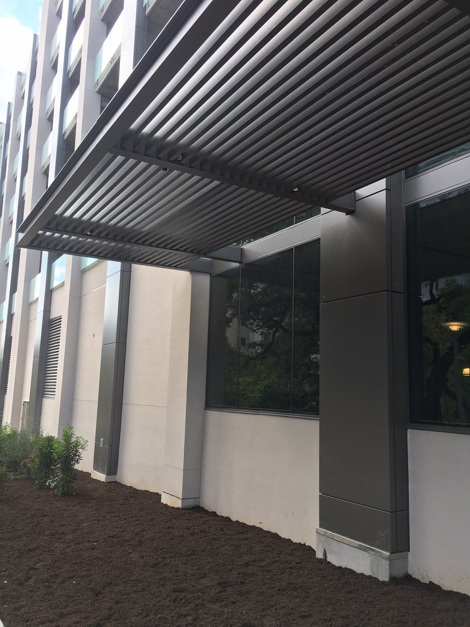 A large building with a canopy over the entrance