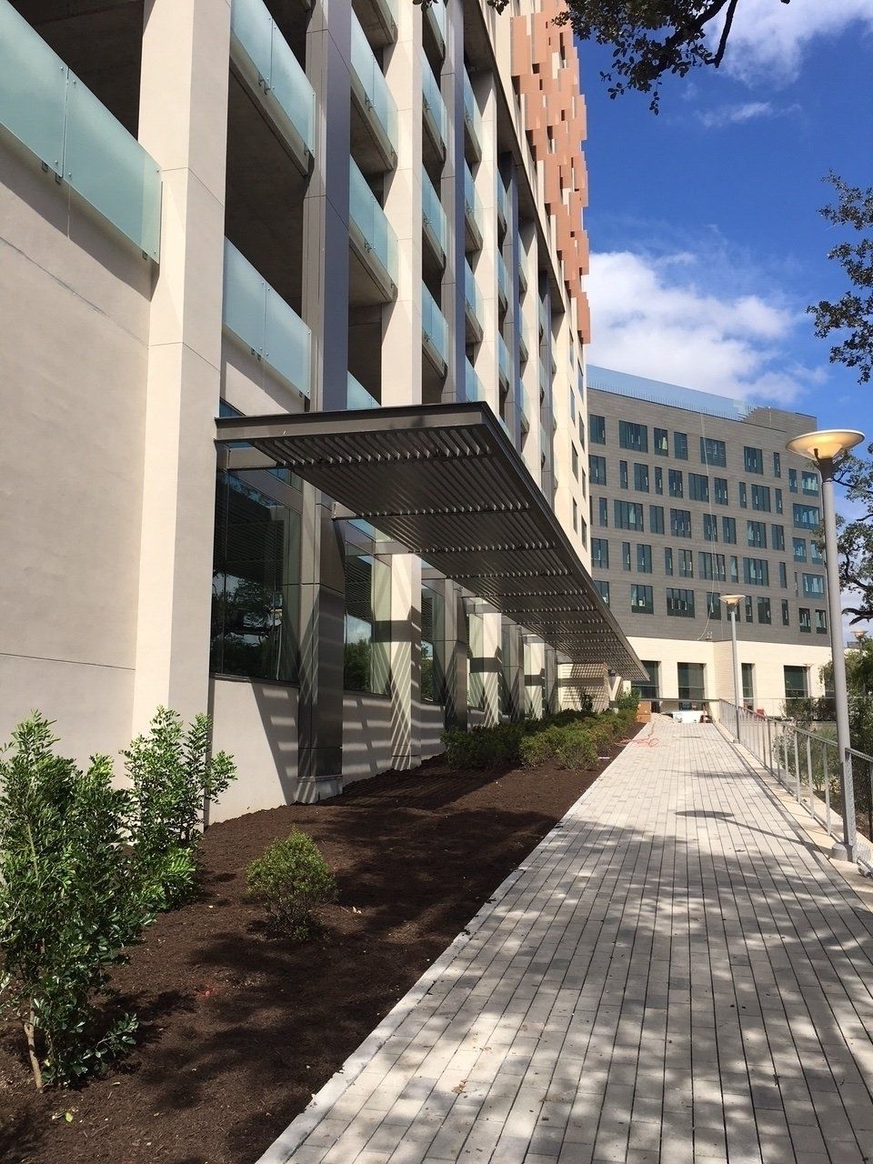 A large building with a walkway leading to it