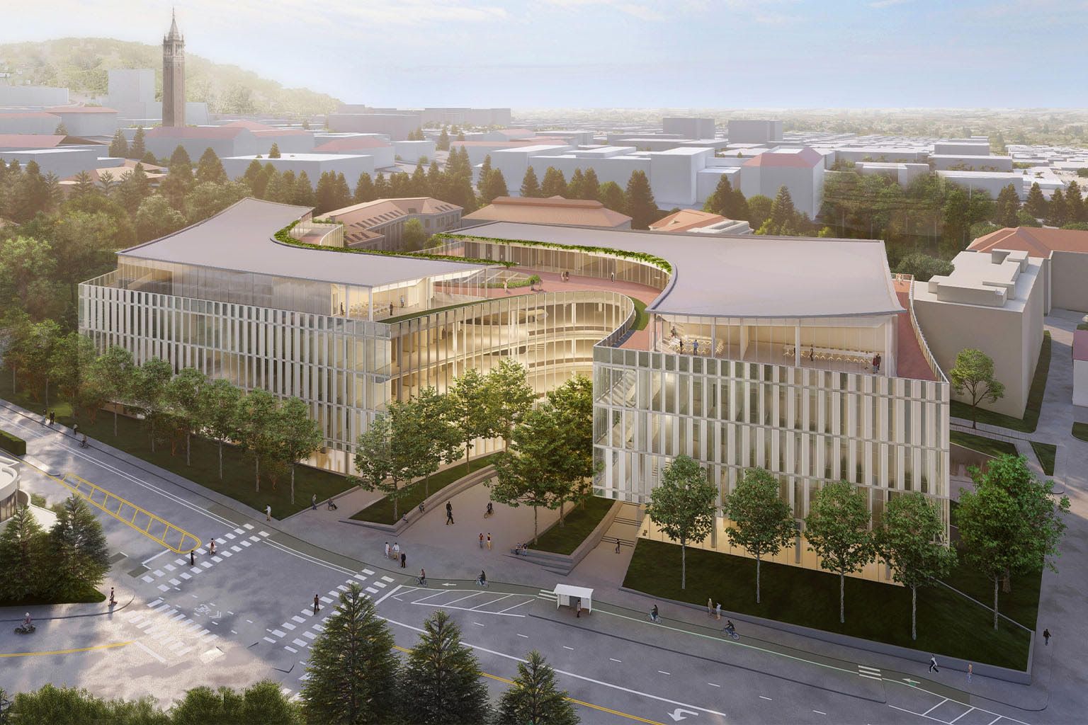 an aerial view of a large building surrounded by trees in a city .