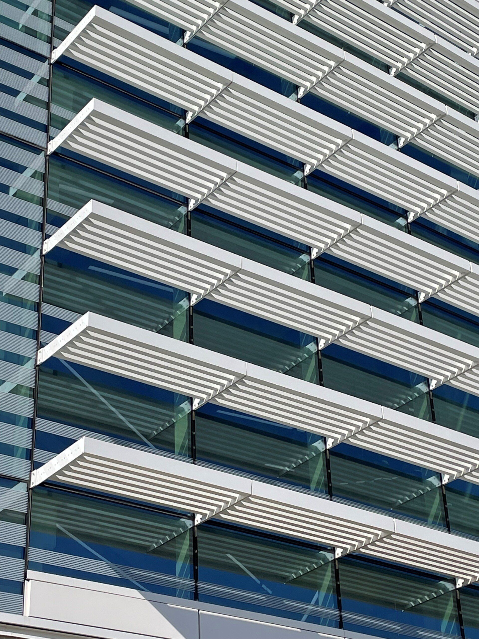 A building with a lot of windows and a lot of shades