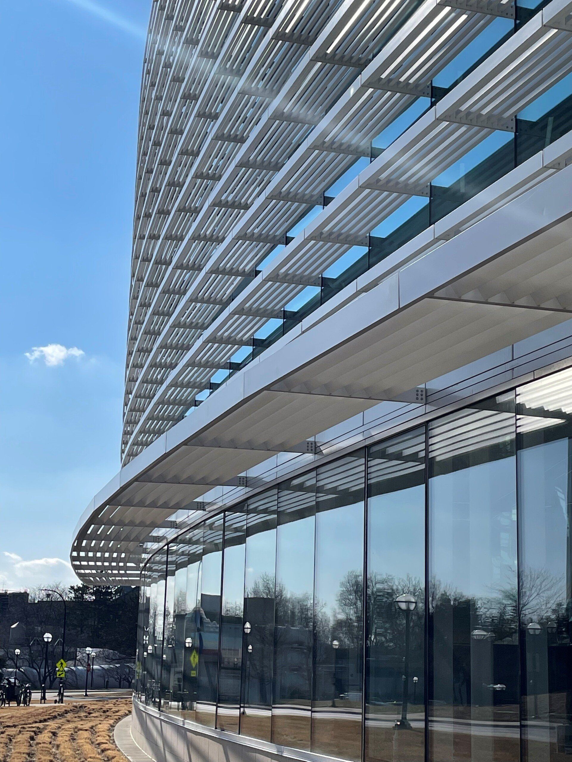 A large building with a lot of windows and a canopy