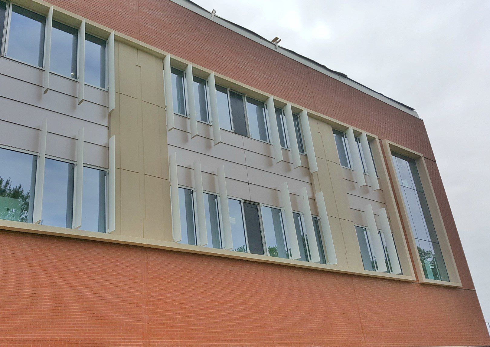 A brick building with a lot of windows on it