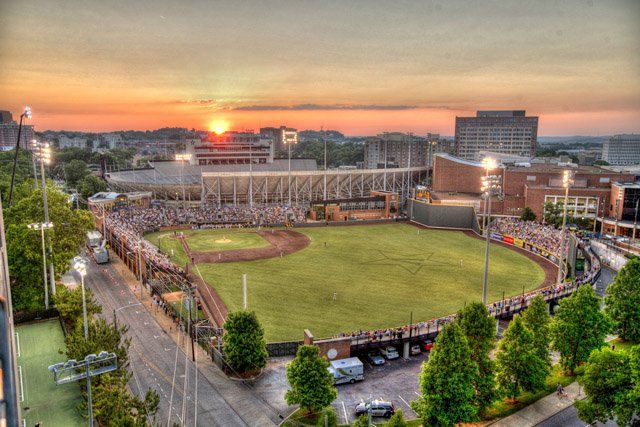 An aerial view of a baseball stadium at sunset