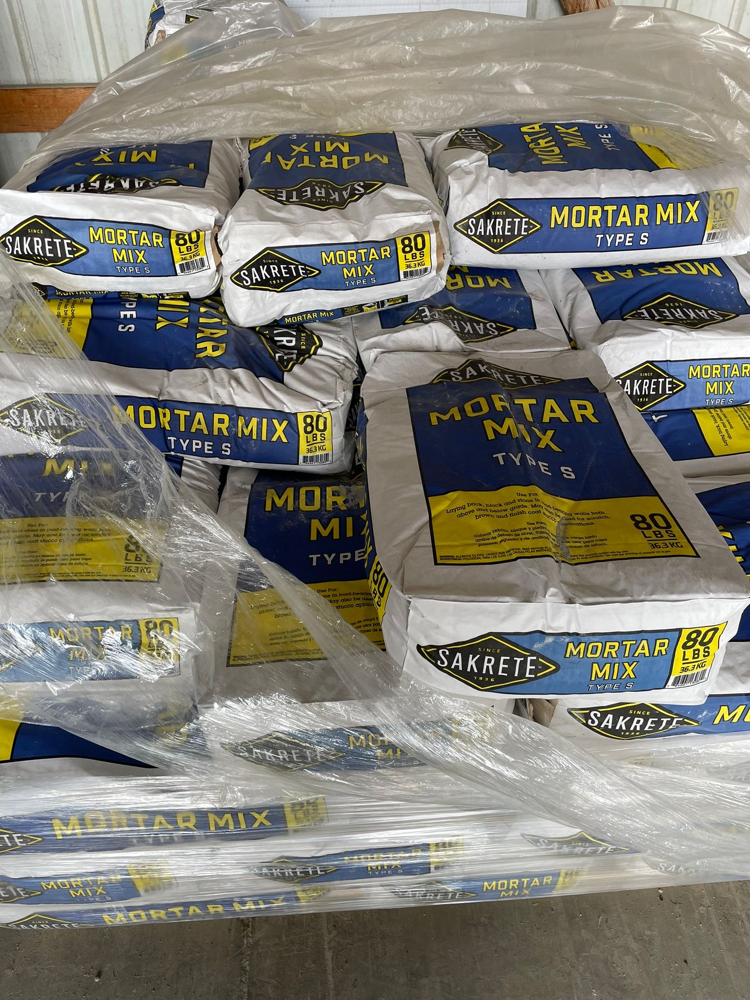 bags of motor mix sitting on pallet