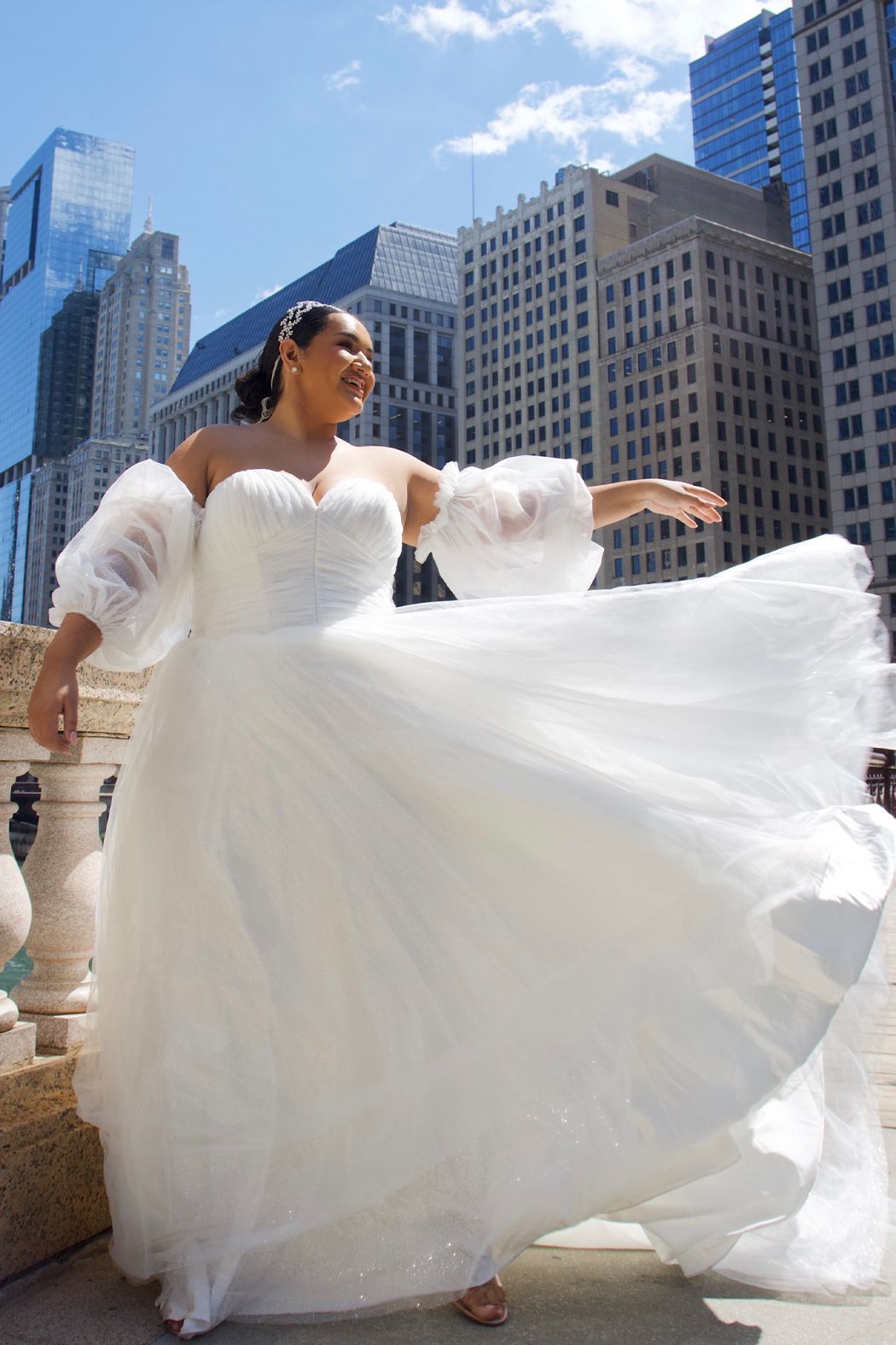 Bride and groom kissing, groom dipping bride on a street, autumn setting.