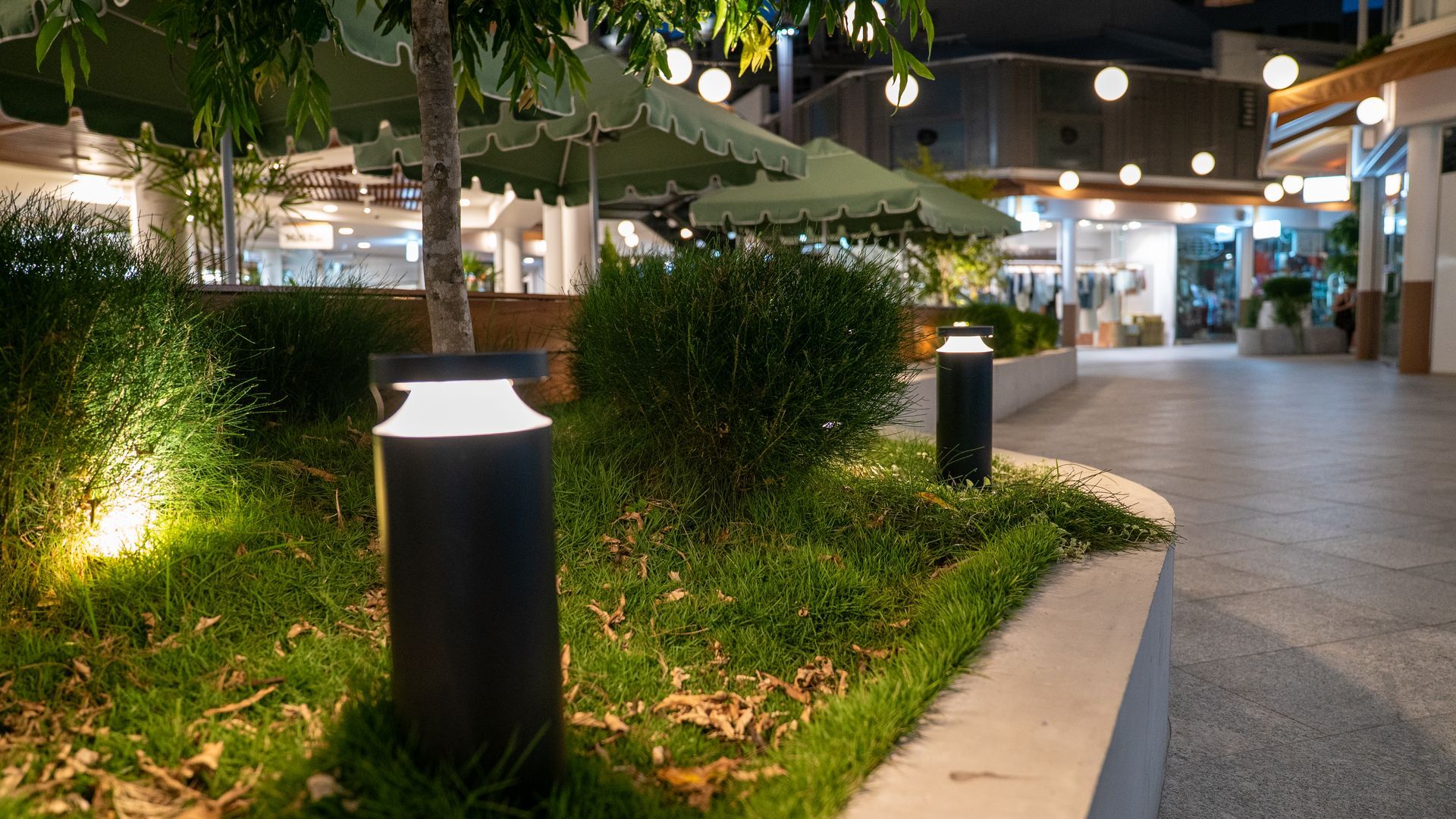 Outdoor Walkway at Night with Landscaped Greenery — Ralph Ottmann Electrical in Pomona, QLD