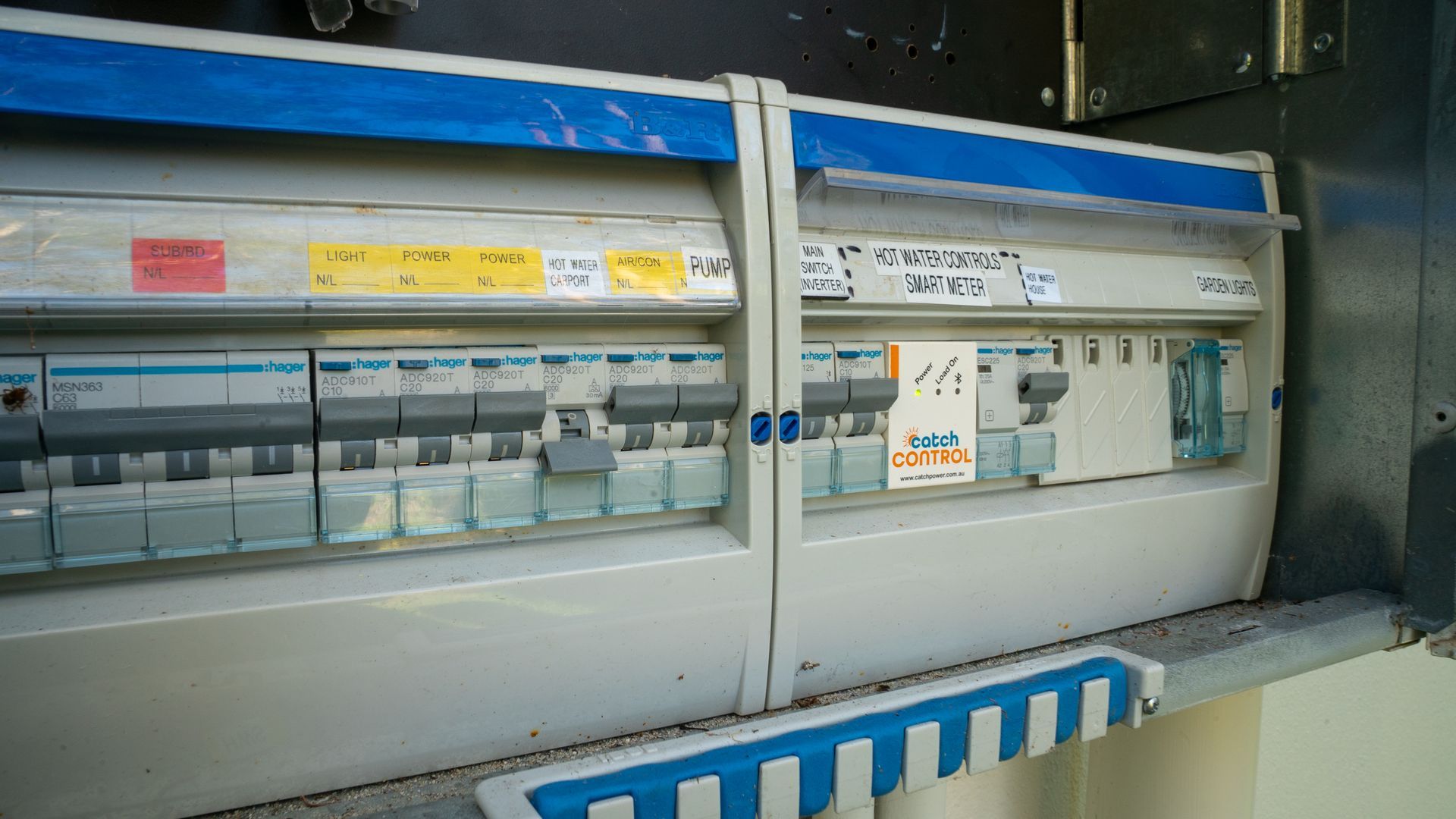 Row of Electrical Circuit Breakers in A Wall-Mounted Control Panel — Ralph Ottmann Electrical in Sunshine Beach, QLD