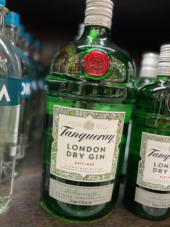 green bottle of dry gin in liquor store