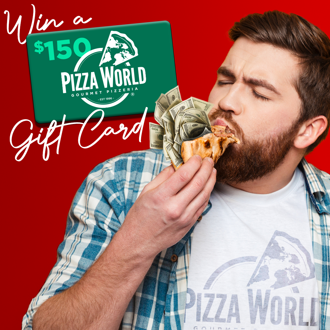A man is eating a pizza with a pizza world gift card in the background