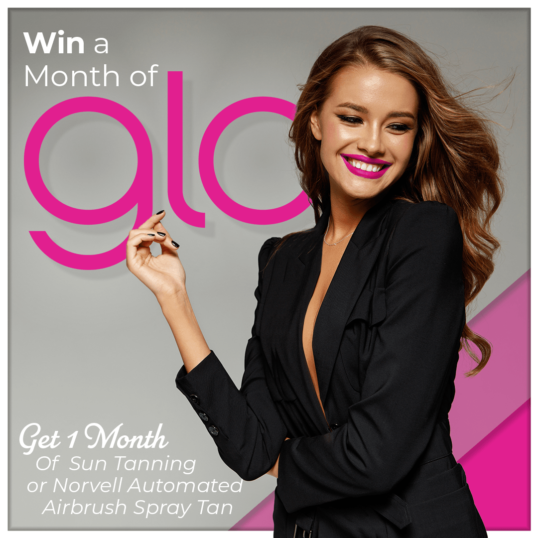 A woman is standing in front of a sign that says win a month of glo