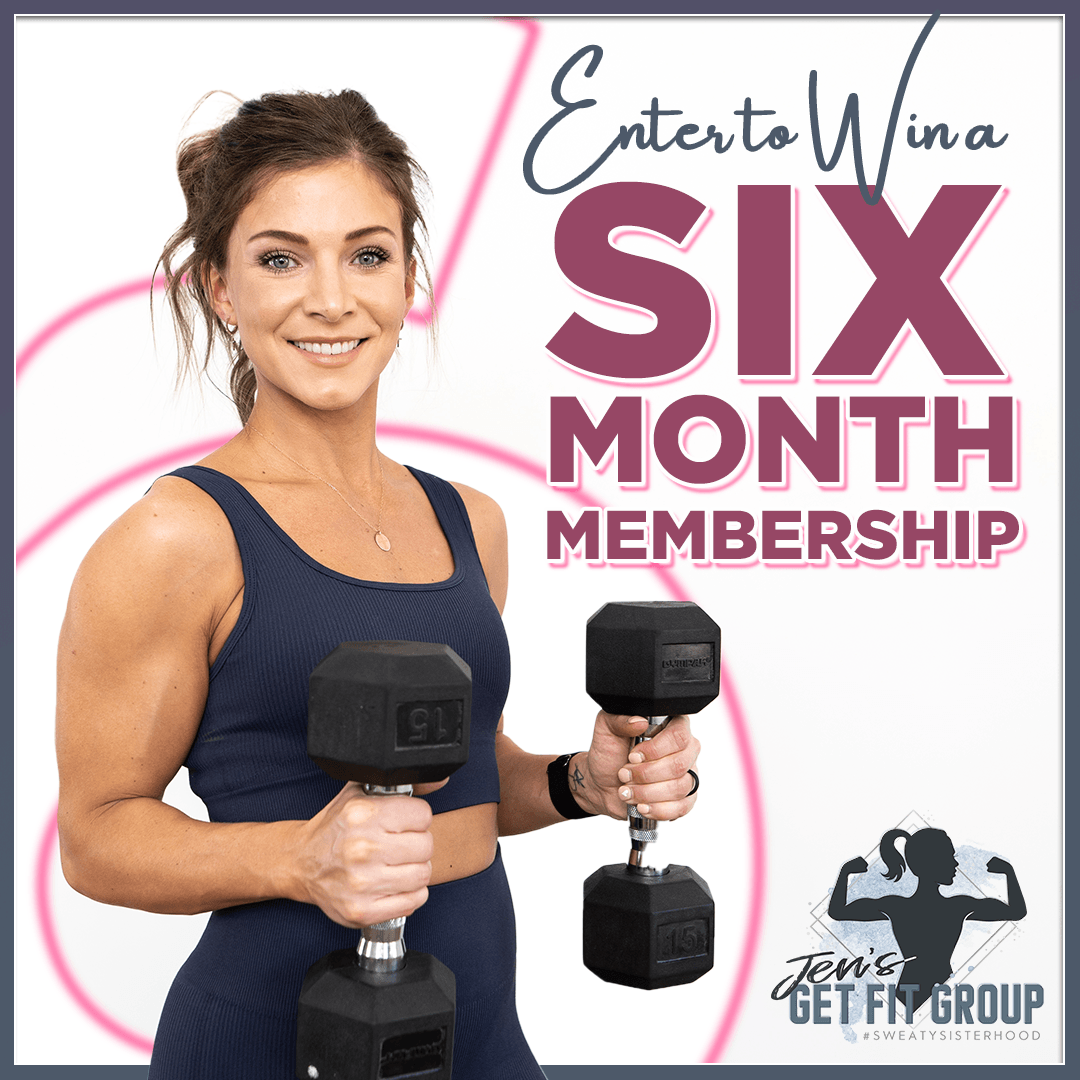 A woman is holding two dumbbells in her hands.