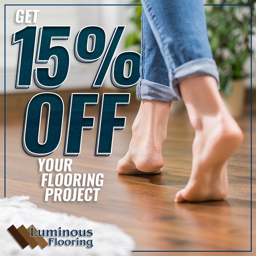 A woman is walking barefoot on a wooden floor.