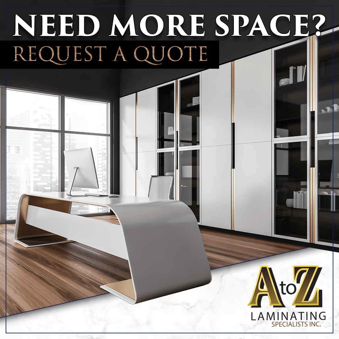 A picture of an office with a desk and cabinets.