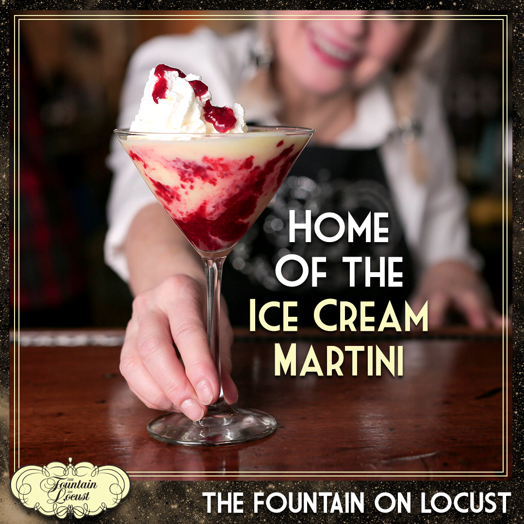 A woman is holding a martini with ice cream on top