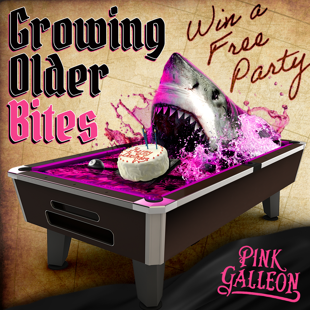 A pool table with a shark and a cake on it