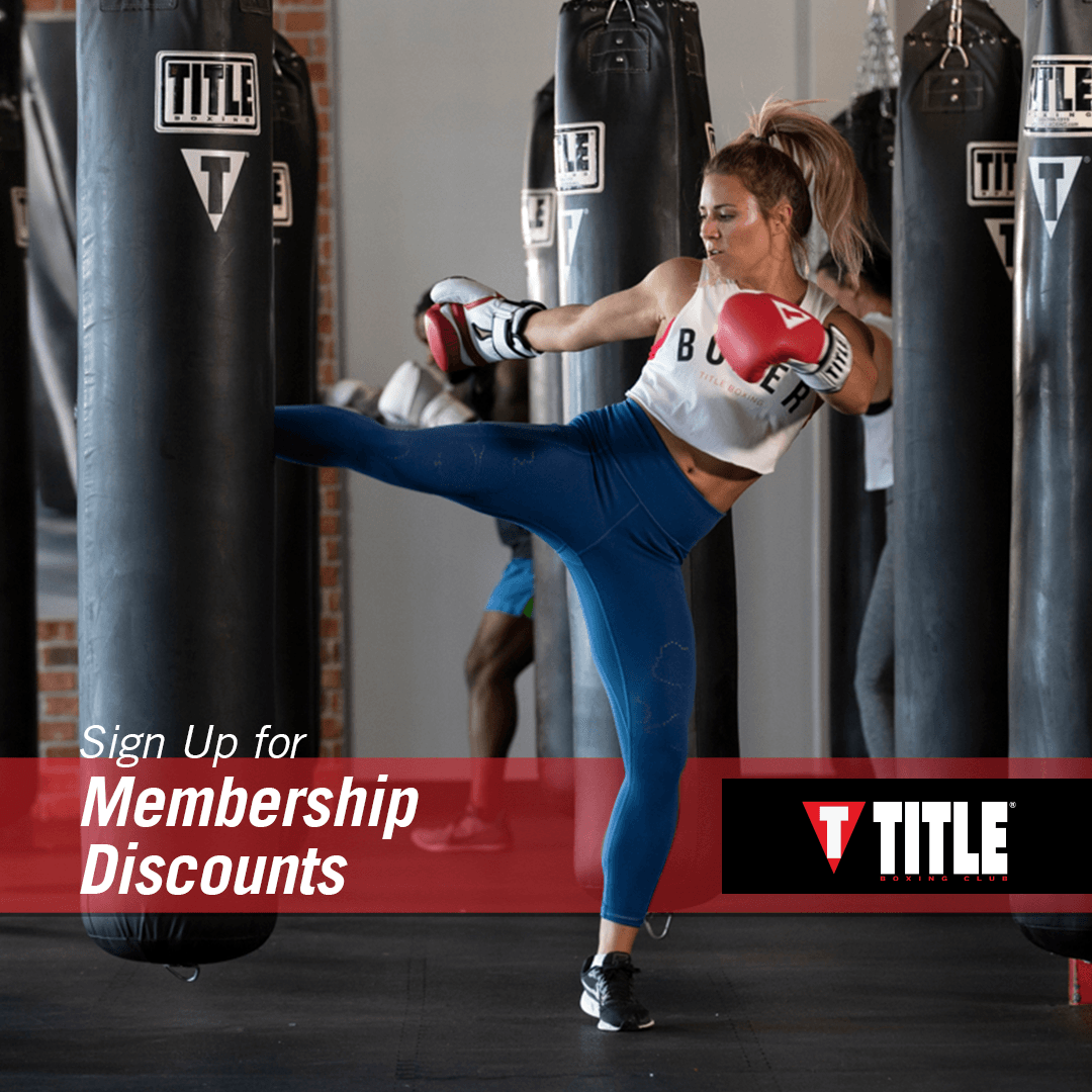 A title boxing gym ad with a woman kicking