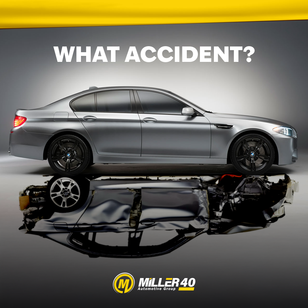 A silver car with the words what accident on it