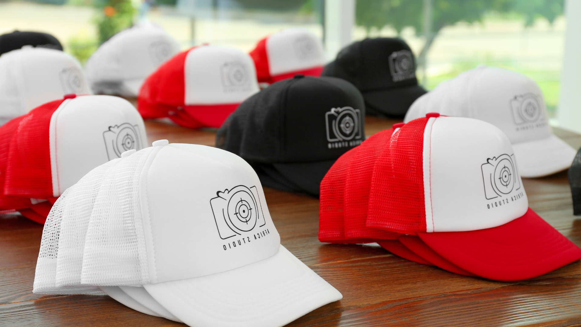 a bunch of hats are stacked on top of each other on a table .