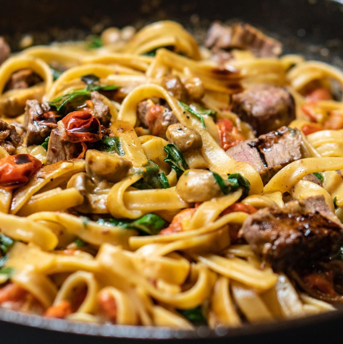 pasta dish with meat and herbs