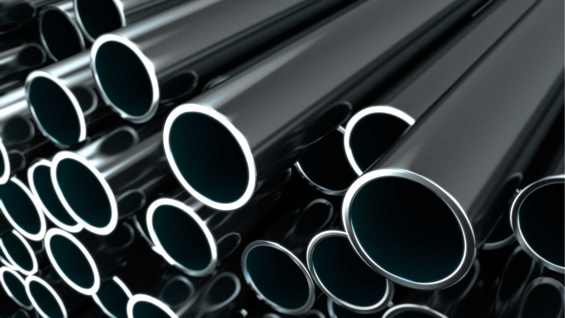 A bunch of black metal pipes stacked on top of each other