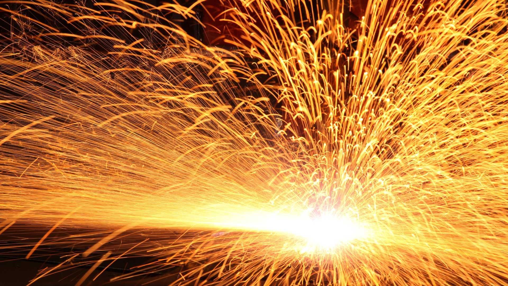 A close up of a fireworks display with a lot of sparks coming out of it.