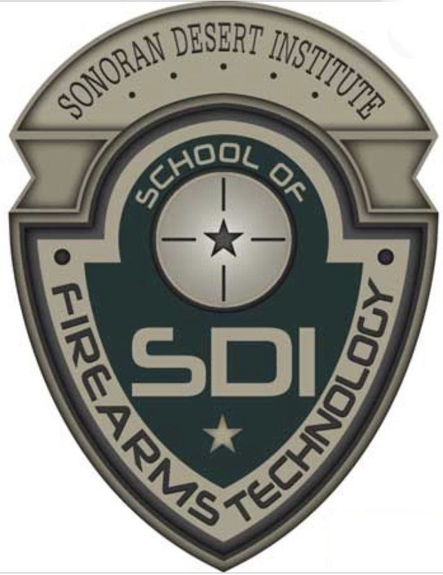 Logo of the Sonoran Desert Institute, School of Firearms Technology. Shield-shaped, featuring a target, star, and SDI initials.