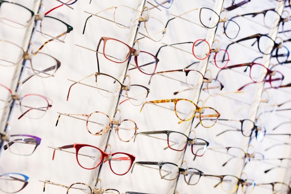 Eyeglasses Displayed on a White Grid — EyeMax EyeCare in Wallsend, NSW