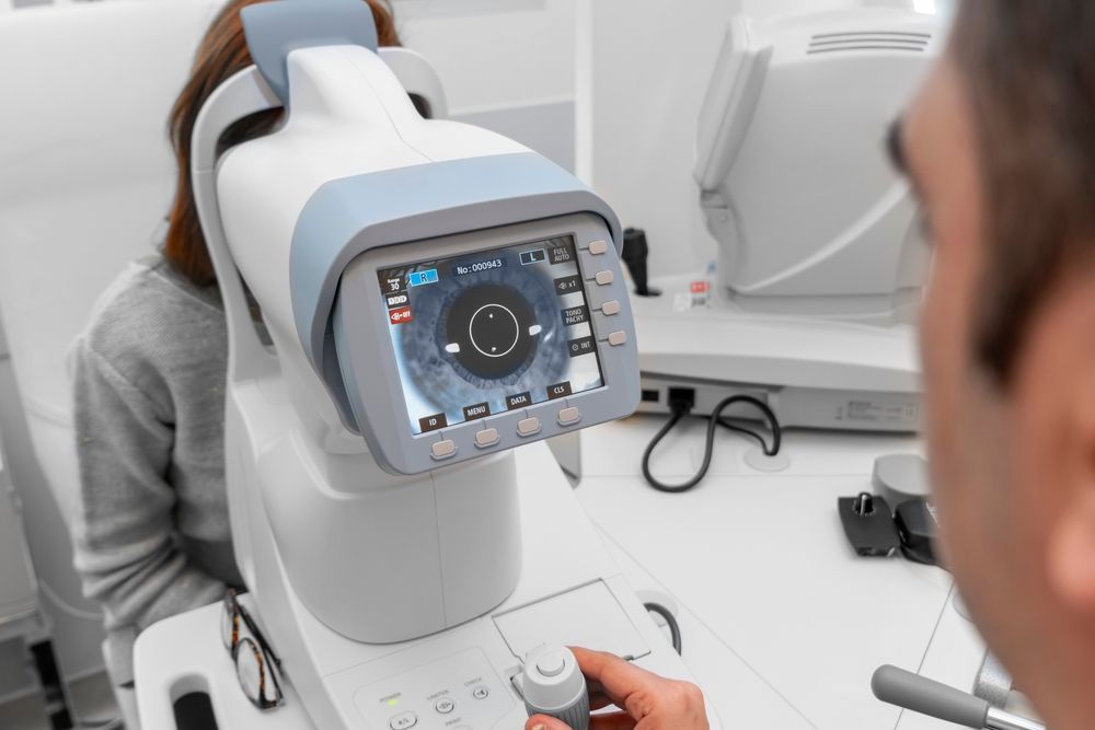 Patient Using Eye Examination Machine — EyeMax EyeCare in Wallsend, NSW
