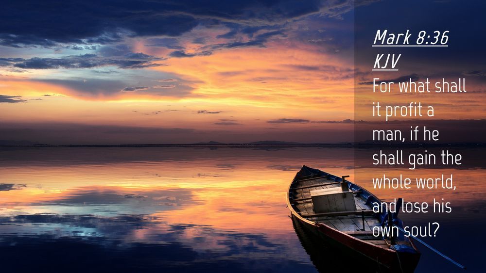 A boat is floating on top of a body of water with a sunset in the background.