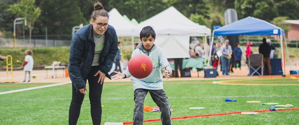 KEEN Volunteer and Athlete with Red Ball