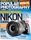 a nikon d3000 camera is on the cover of a popular photography magazine .