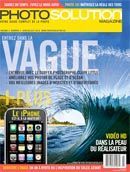 a magazine cover with a picture of a wave and a cell phone on it .