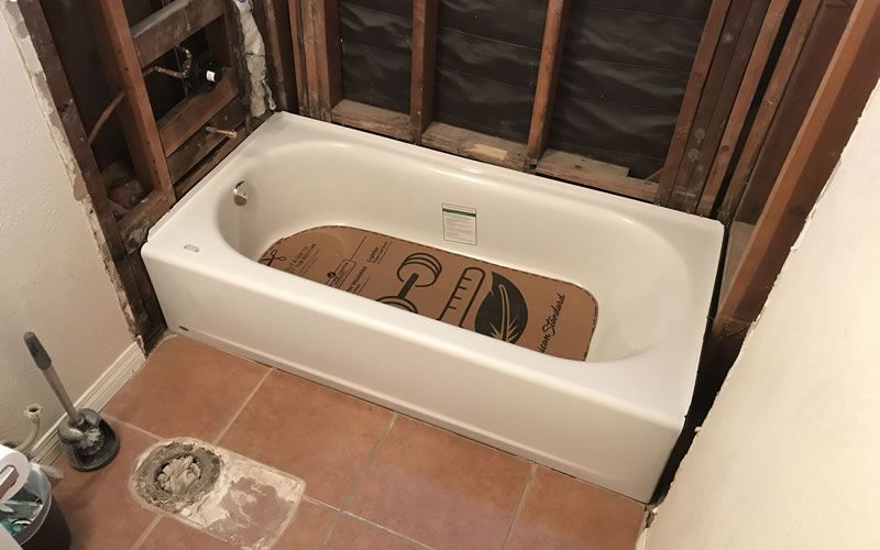 a hose is connected to a washer and dryer outlet