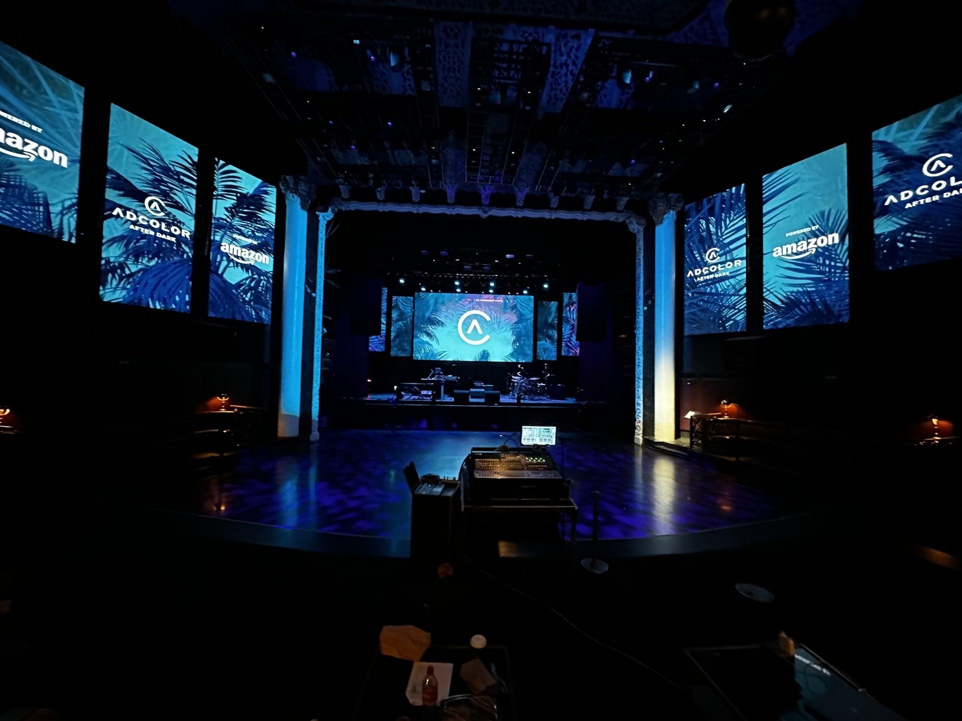 A large stage with a lot of screens on it