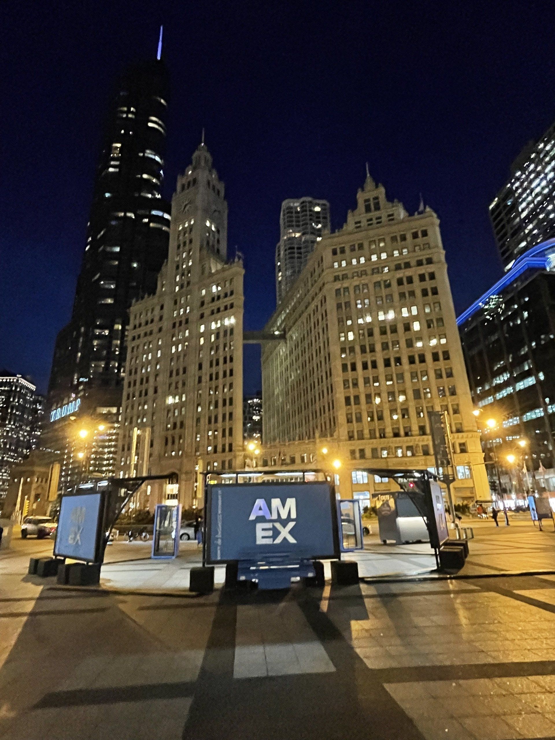 A sign that says am ex in front of a city skyline