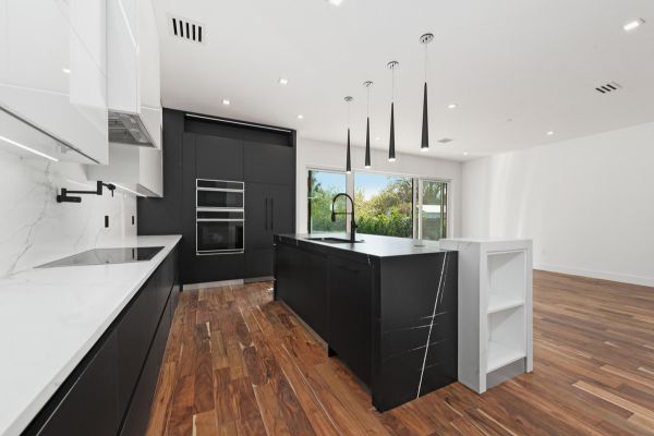 There is a large island in the middle of the kitchen.