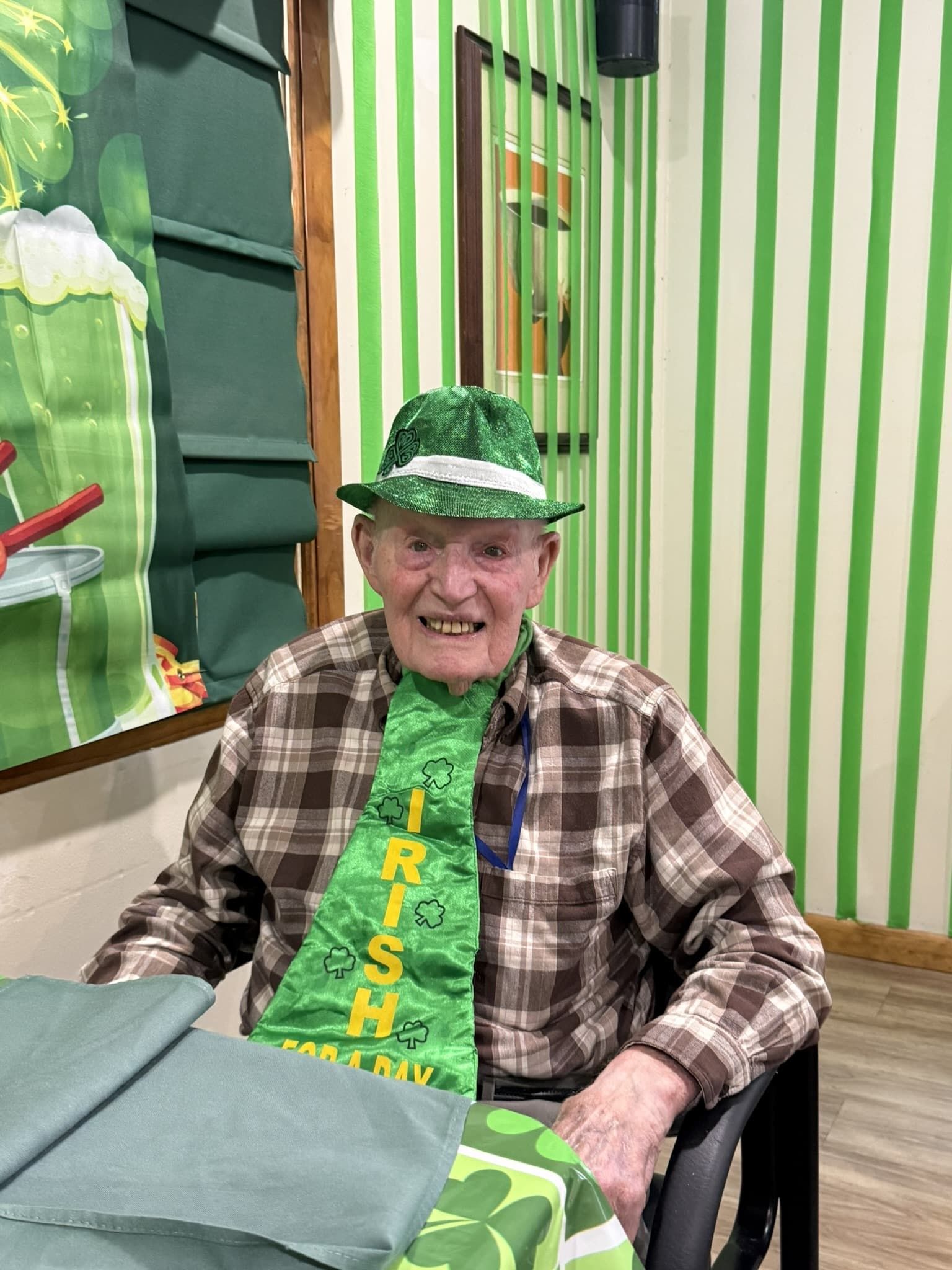 A person wearing a green hat and an 
