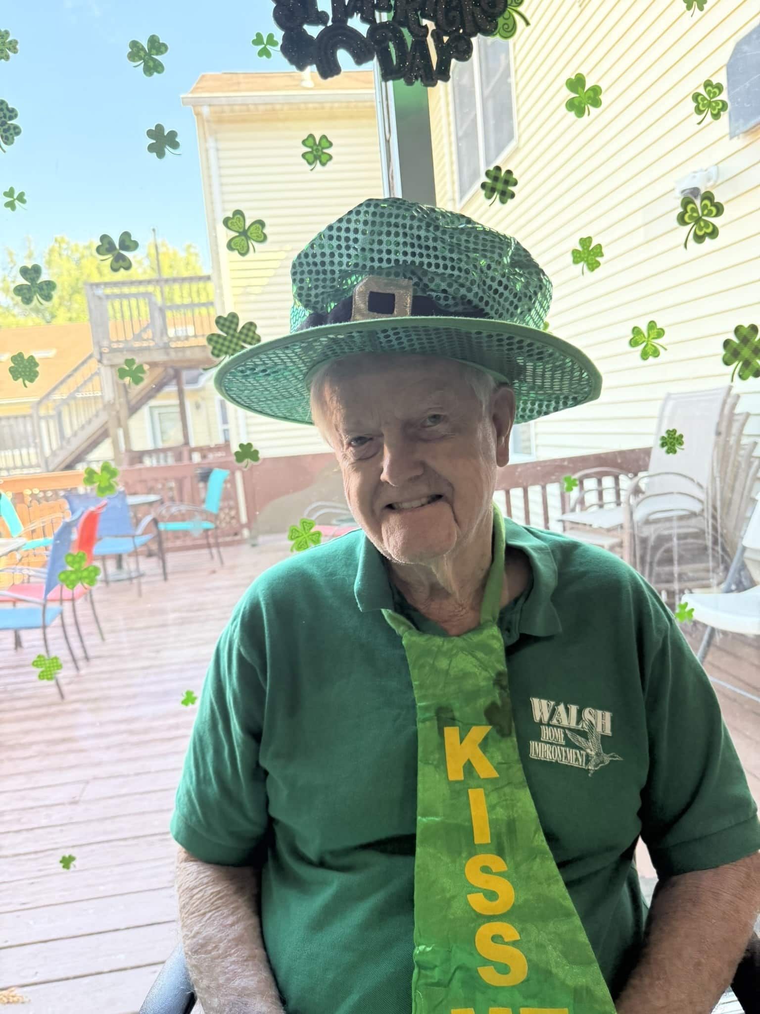 A person wearing a green leprechaun hat and a 