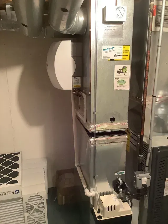 A room with a heater and air conditioner in it.