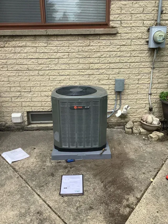 Outdoor air conditioning unit with tools scattered around. Outdoor air conditioning unit with tools scattered around.