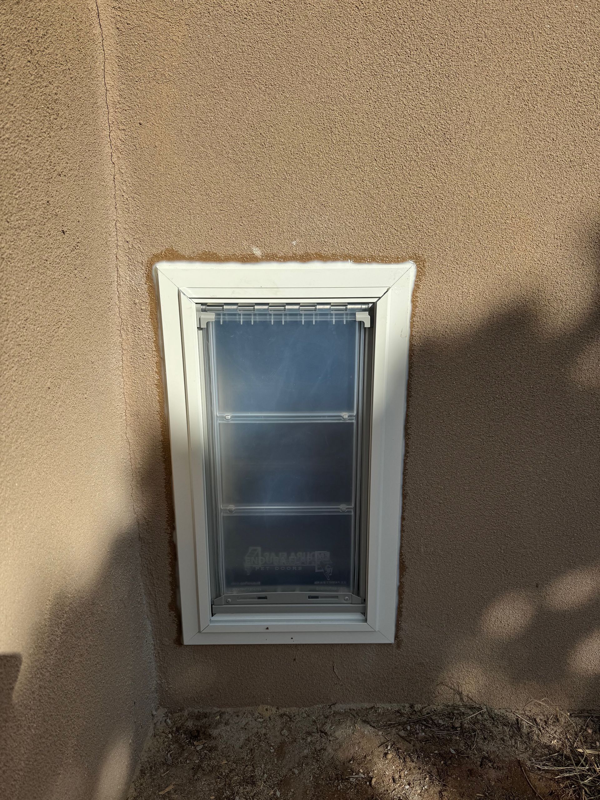 A small window on the side of a building.